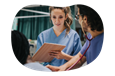 Nurses discussing a patient's chart.