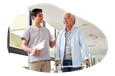 An occupational therapist helps a patient walk during a therapy session