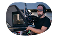 A production studio owner carefully captures footage for a project