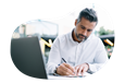 A claims adjuster writing notes in response to an insurance claim