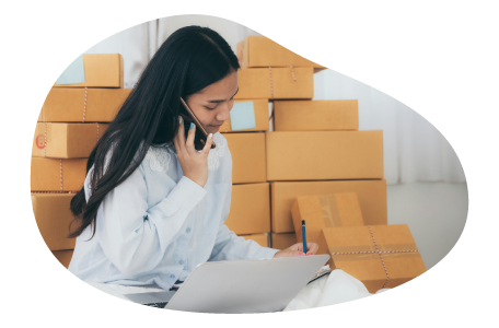 An e-commerce business owner taking a purchase order over the phone An e-commerce business owner taking a purchase order over the phone