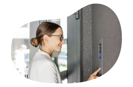 A small business owner setting an alarm inside their storefront. A small business owner setting an alarm inside their storefront.