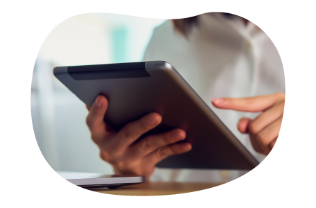 A small business owner calculating the cost of cyber insurance. A small business owner calculating the cost of cyber insurance.