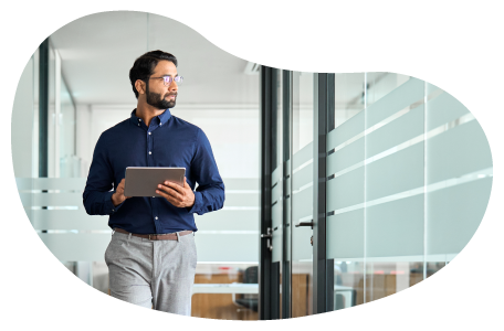 A human resources rep walking through the office of a small business. A human resources rep walking through the office of a small business.